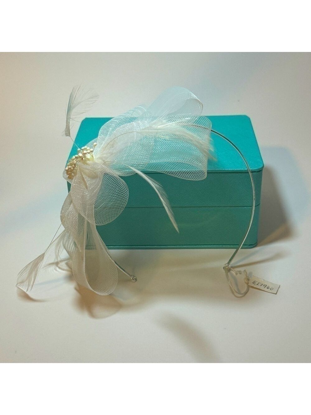 Brand new feather and ribbon head band.